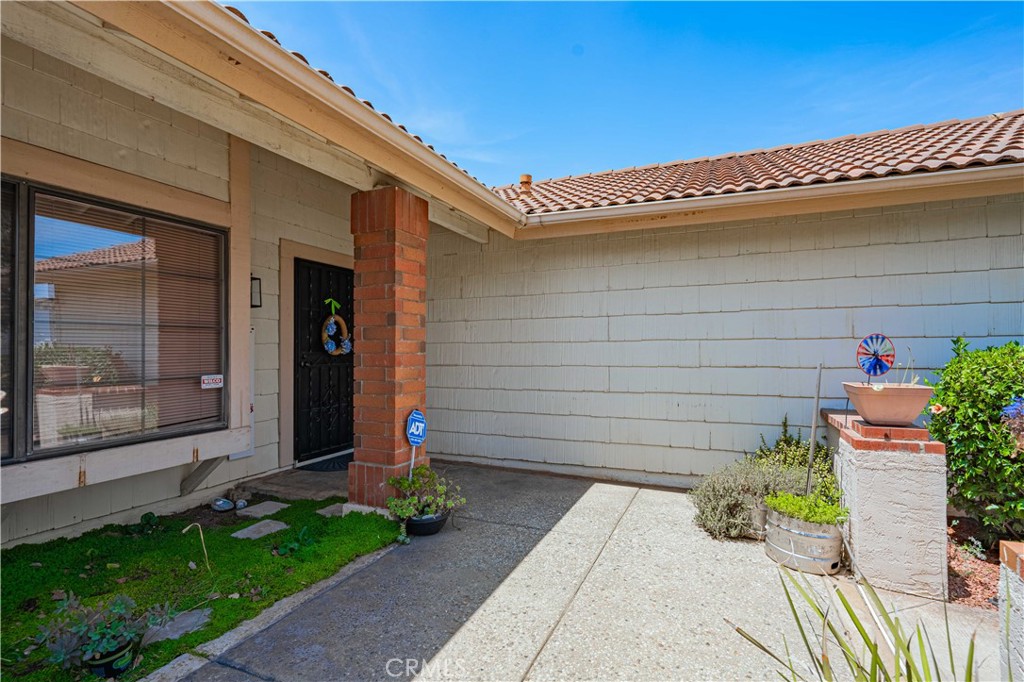 27571 Cabrillo Drive Menifee, CA 92586 - Photo 6 of 56 a front view of a house with a garden