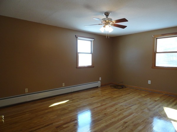 212 N Road Westhampton, MA 01027 - Photo 11 of 29 a view of an empty room with wooden floor and a window