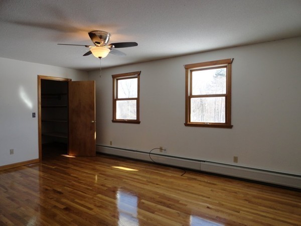 212 N Road Westhampton, MA 01027 - Photo 13 of 29 a view of an empty room with wooden floor and a window