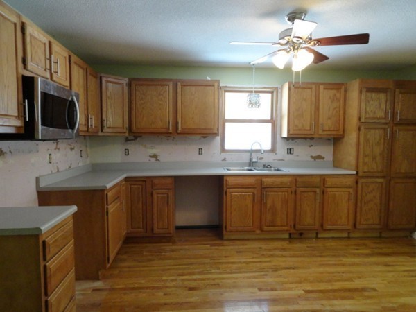 212 N Road Westhampton, MA 01027 - Photo 8 of 29 a kitchen with stainless steel appliances granite countertop a sink a stove a oven a refrigerator with grey cabinets