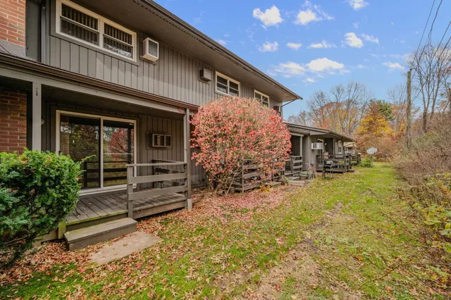 front view of a house with a bench