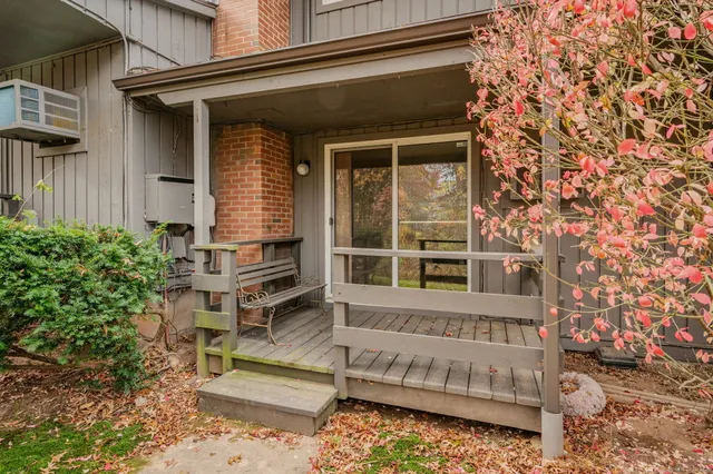 a front view of a residential apartment building with a garden