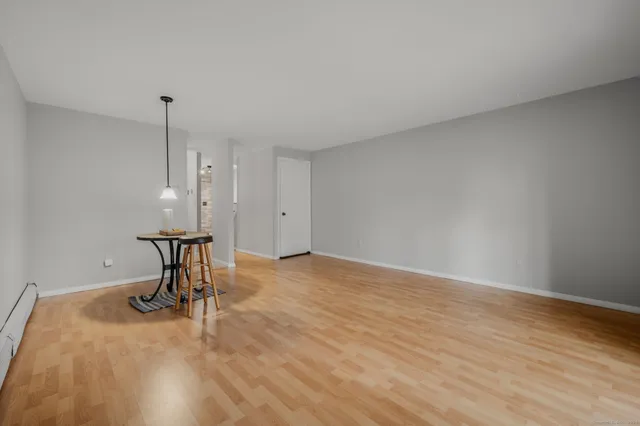 a view of a room with a table and chair