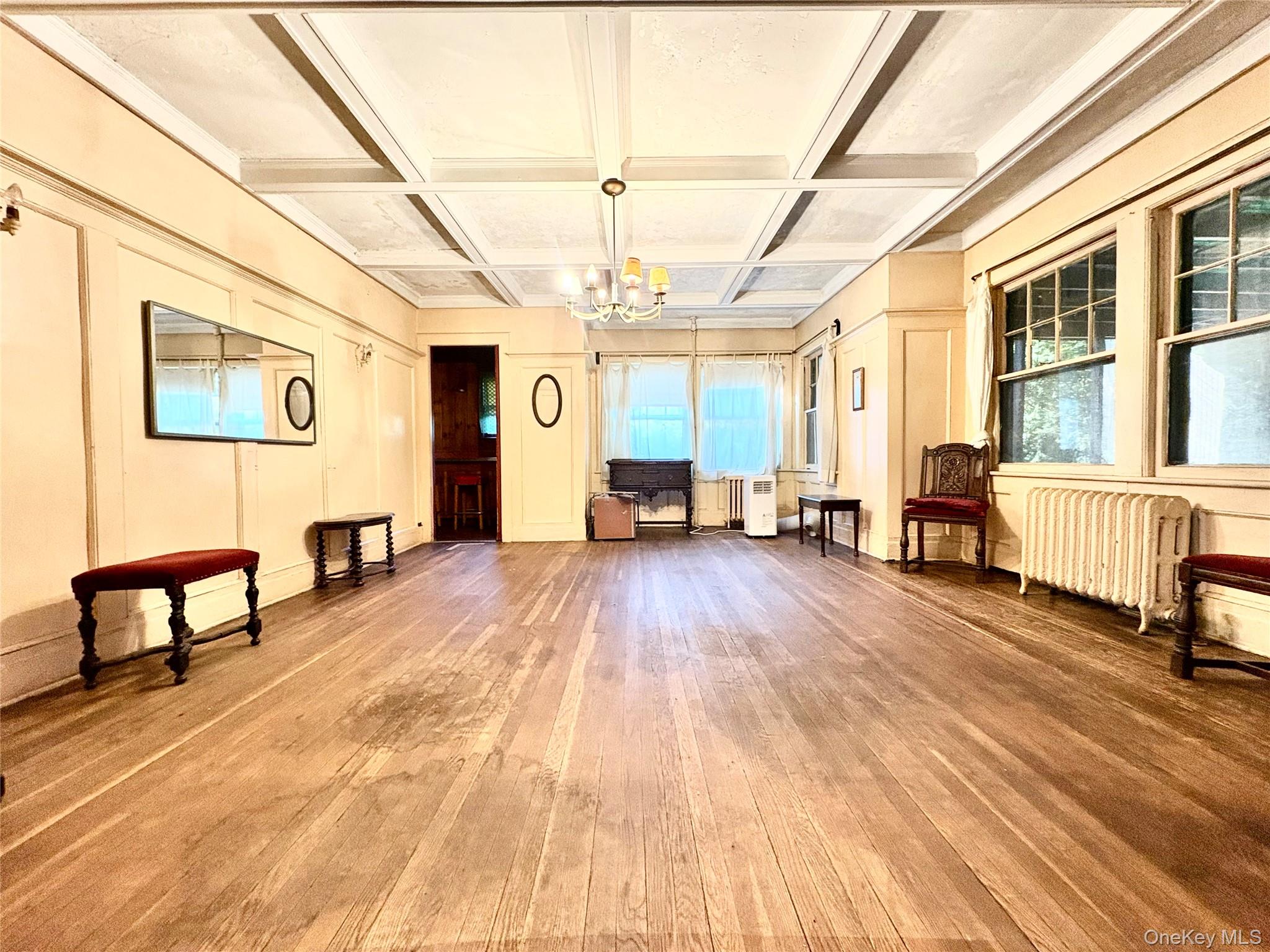 236 Arleigh Road Queens, NY 11363 - Photo 5 of 25 Large Dining room w/ hardwood floors and Decorative coffered ceiling with recessed panels