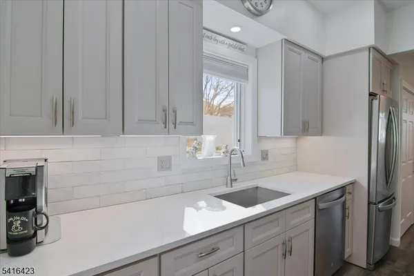 a kitchen with a sink and cabinets