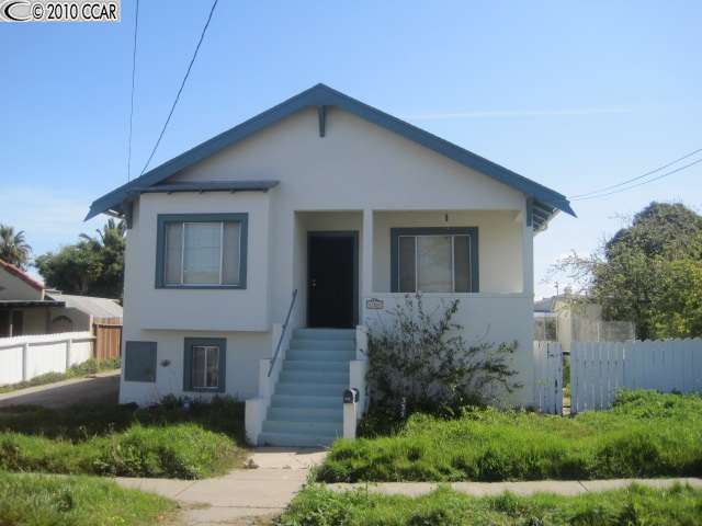 335 Garretson Avenue Rodeo, CA 94572 - Photo 1 of 1 a front view of a house with a yard