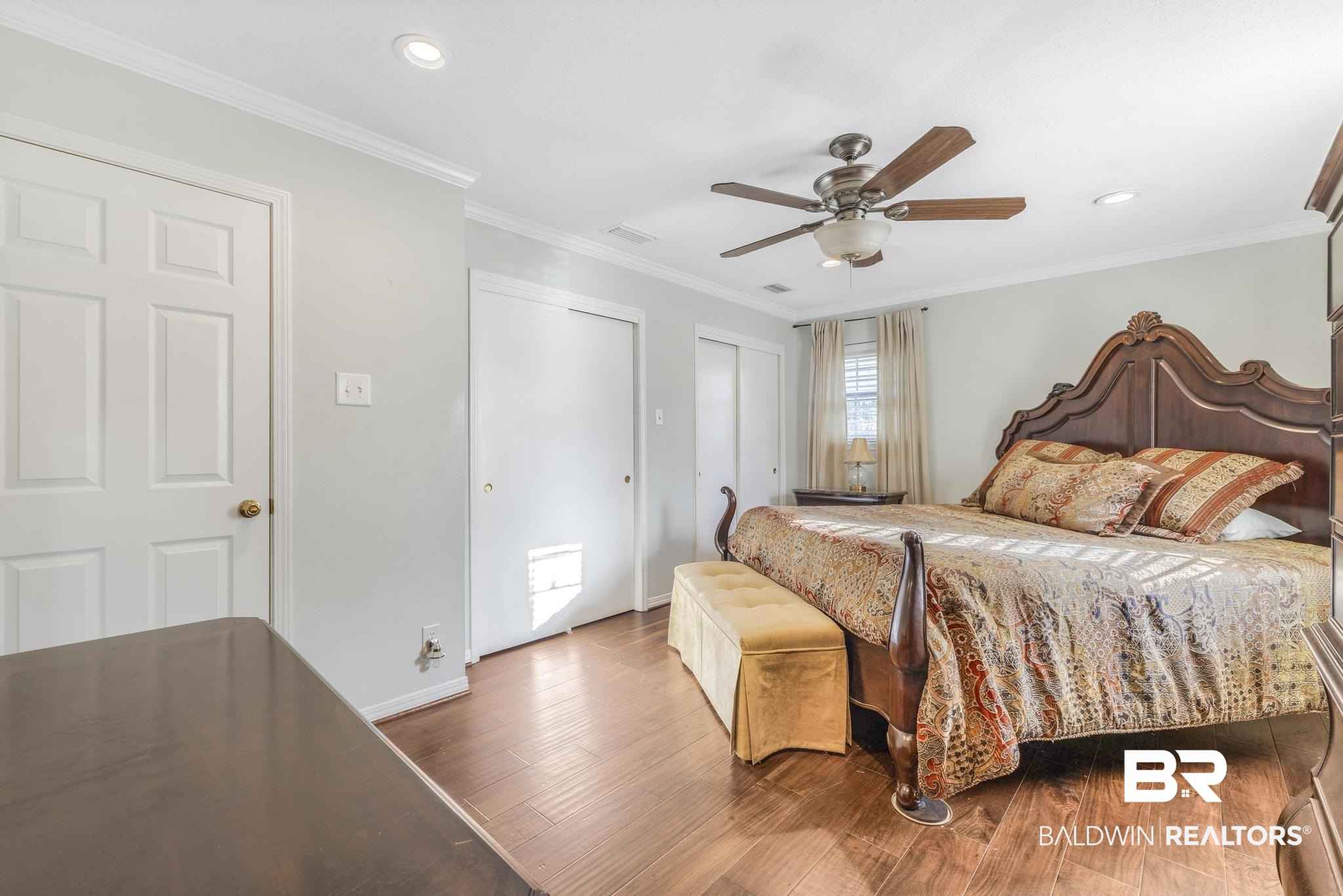 2573 E Road Mobile, AL 36693 - Photo 15 of 45 Bedroom featuring crown molding, two closets, wood finished floors, a ceiling fan, and recessed lighting