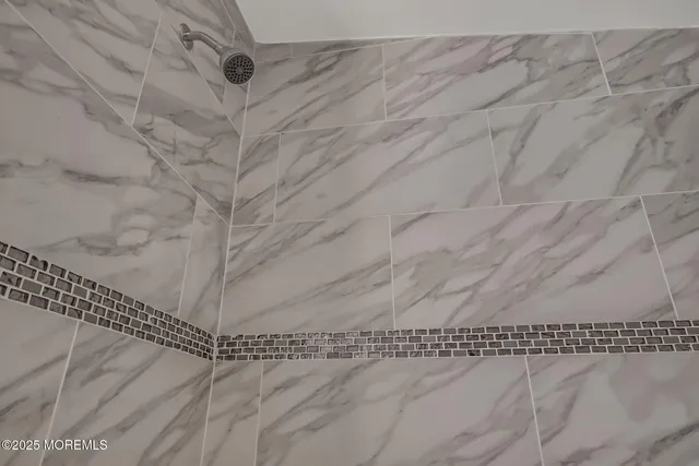 a kitchen with a refrigerator and a sink