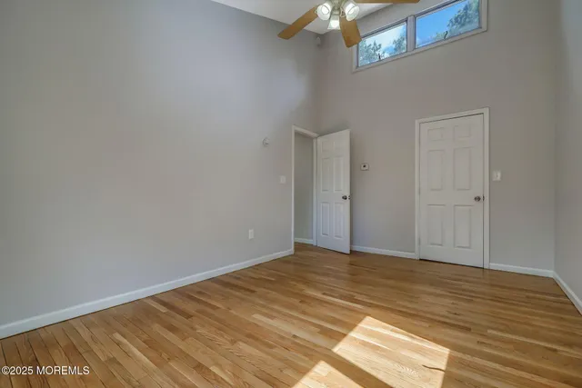 a view of a park with trees in the background
