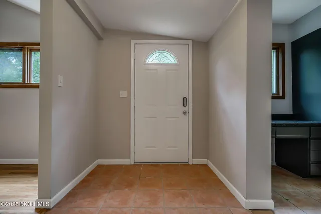 a view of an entryway with hallway