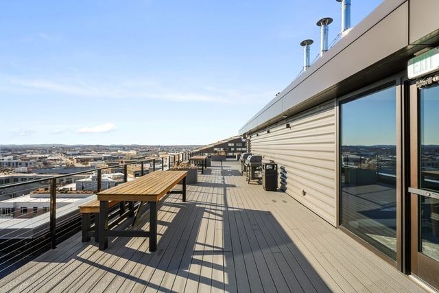 a view of a roof deck with patio
