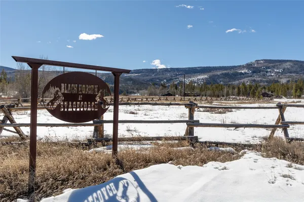 a view of a swimming pool and a yard