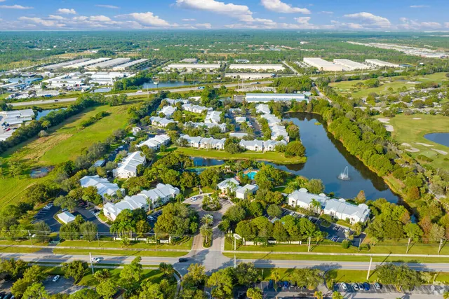an aerial view of a house with a yard and garden
