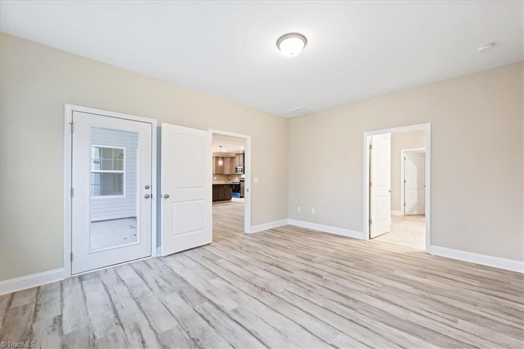1987 Meadowview Drive Graham, NC 27253 - Photo 9 of 23 door off of primary bedroom to screened porch