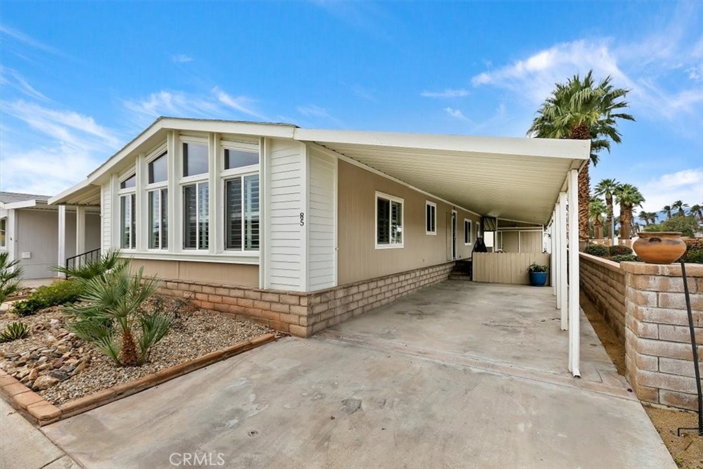 46618 Madison Street, Unit 85 Indio, CA 92201 - Photo 12 of 50 a view of a house with a patio