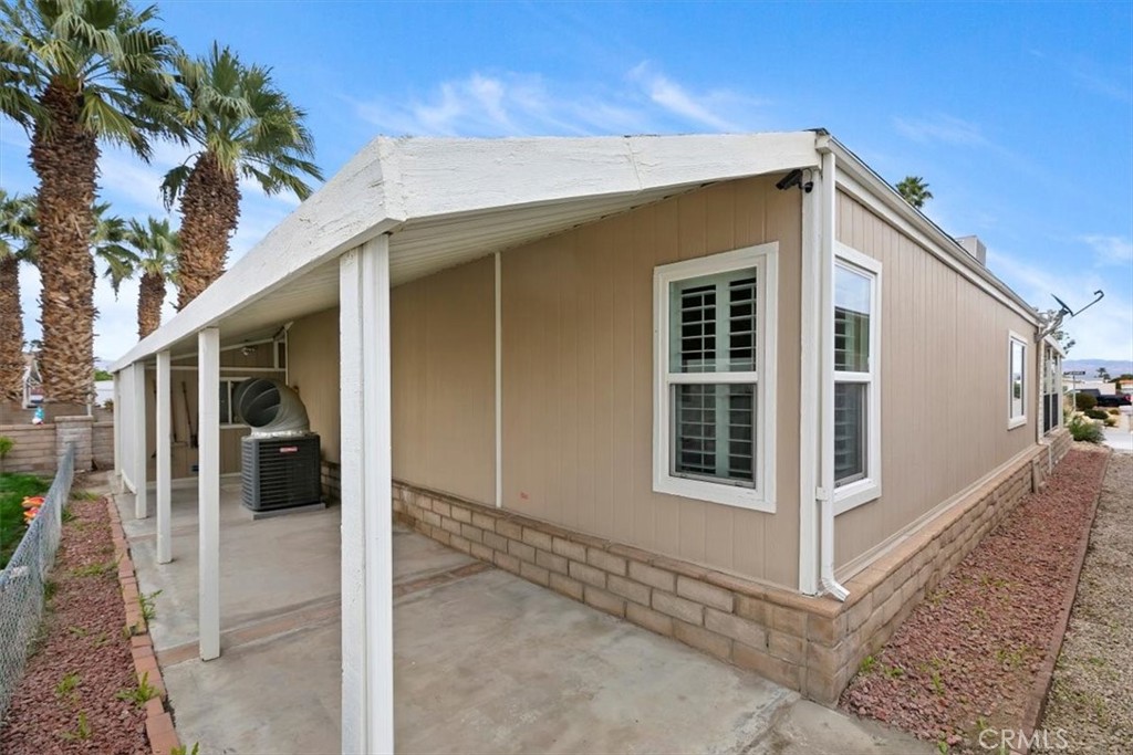 46618 Madison Street, Unit 85 Indio, CA 92201 - Photo 15 of 50 a view of a house with a yard
