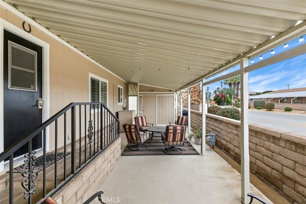 46618 Madison Street, Unit 85 Indio, CA 92201 - Photo 18 of 50 a view of a porch with furniture