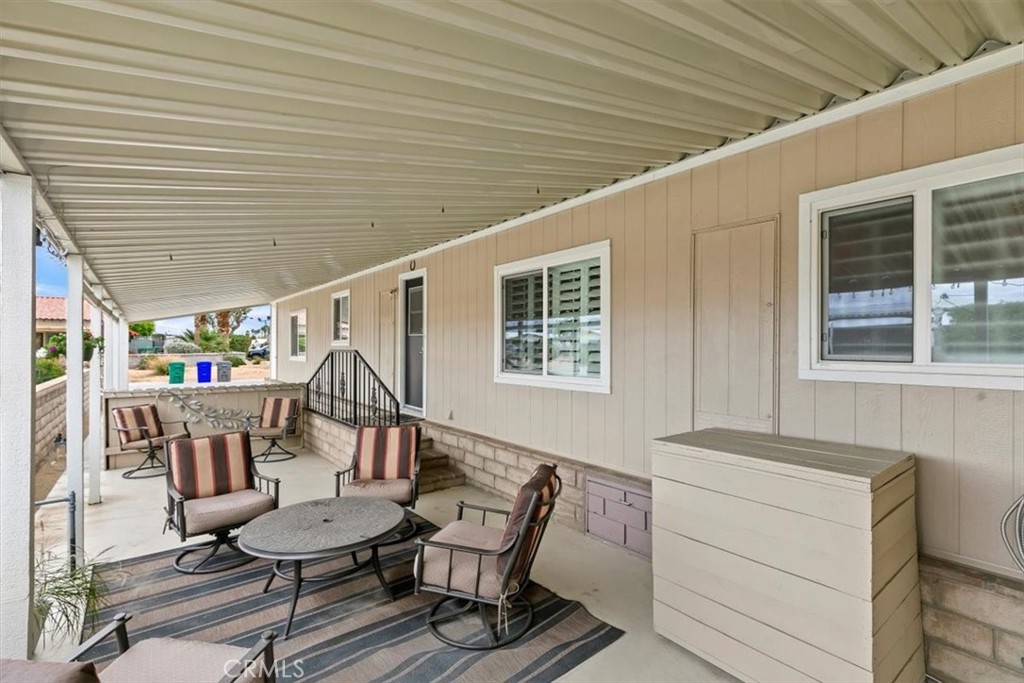 46618 Madison Street, Unit 85 Indio, CA 92201 - Photo 19 of 50 a dining room with furniture and window