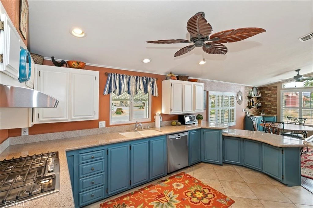 46618 Madison Street, Unit 85 Indio, CA 92201 - Photo 2 of 50 a kitchen with a sink cabinets and window