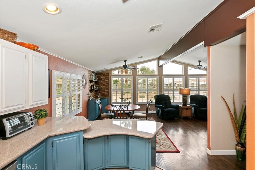 46618 Madison Street, Unit 85 Indio, CA 92201 - Photo 33 of 50 a kitchen with sink refrigerator and large window