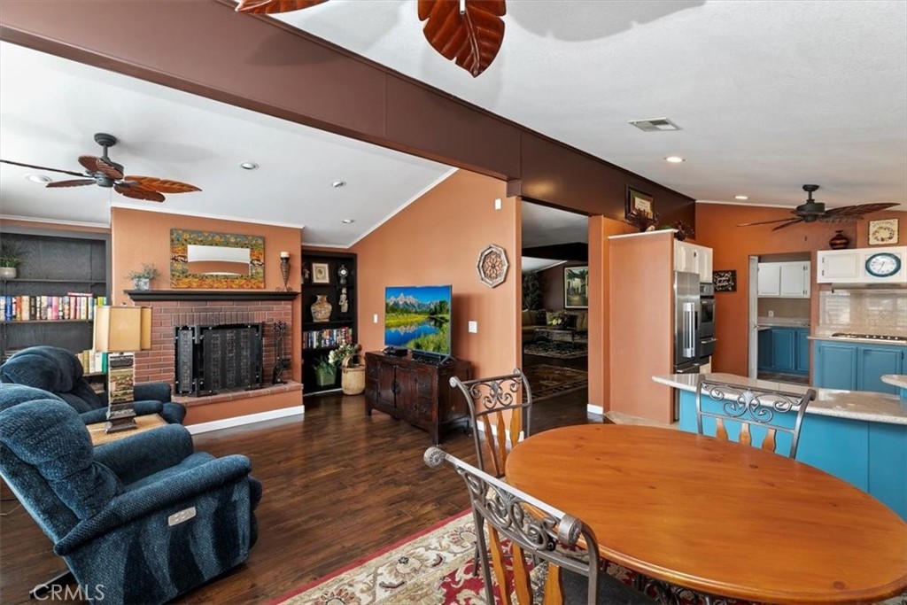 46618 Madison Street, Unit 85 Indio, CA 92201 - Photo 37 of 50 a living room with fireplace furniture and a wooden floor