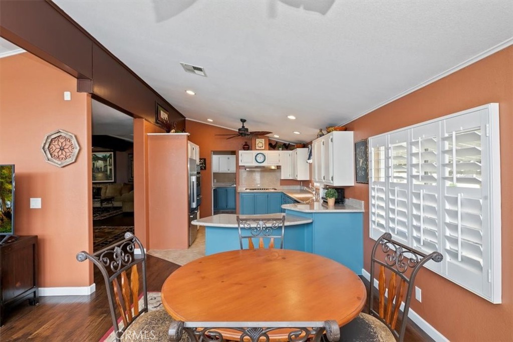 46618 Madison Street, Unit 85 Indio, CA 92201 - Photo 40 of 50 a view of a dining room with furniture window and wooden floor