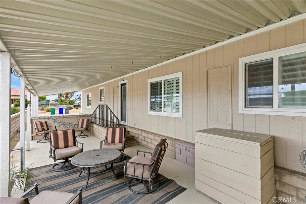 46618 Madison Street, Unit 85 Indio, CA 92201 - Photo 4 of 50 a dining room with furniture and window