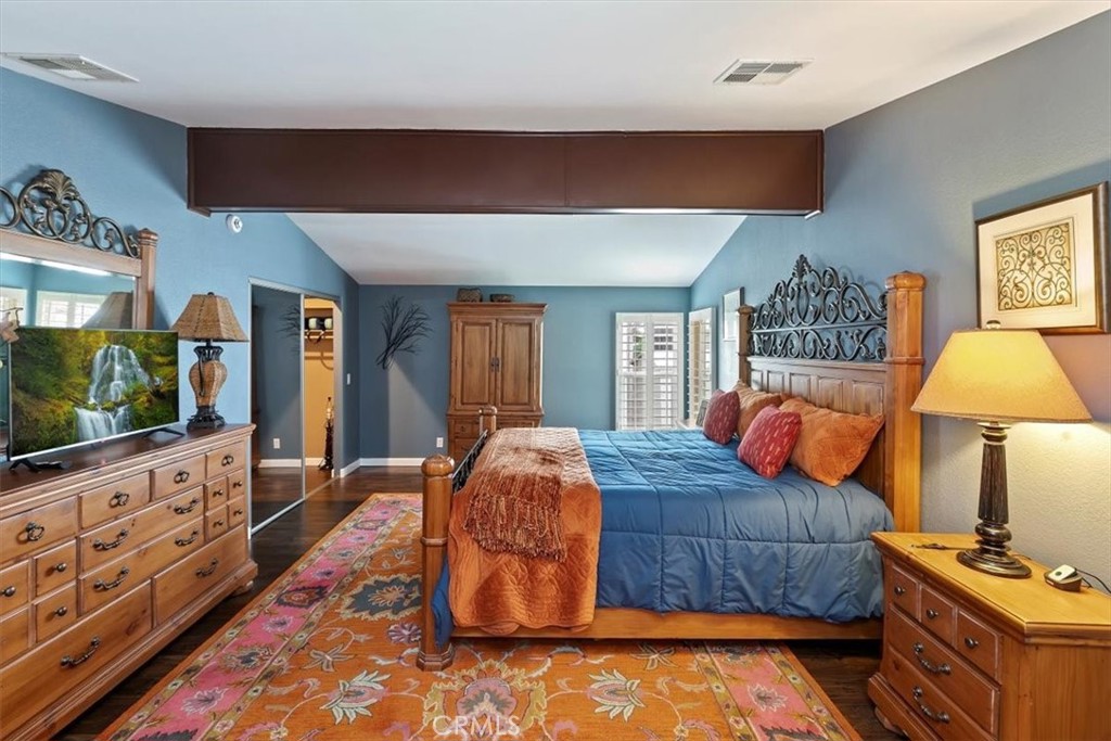 46618 Madison Street, Unit 85 Indio, CA 92201 - Photo 43 of 50 a bedroom with furniture and flat screen tv