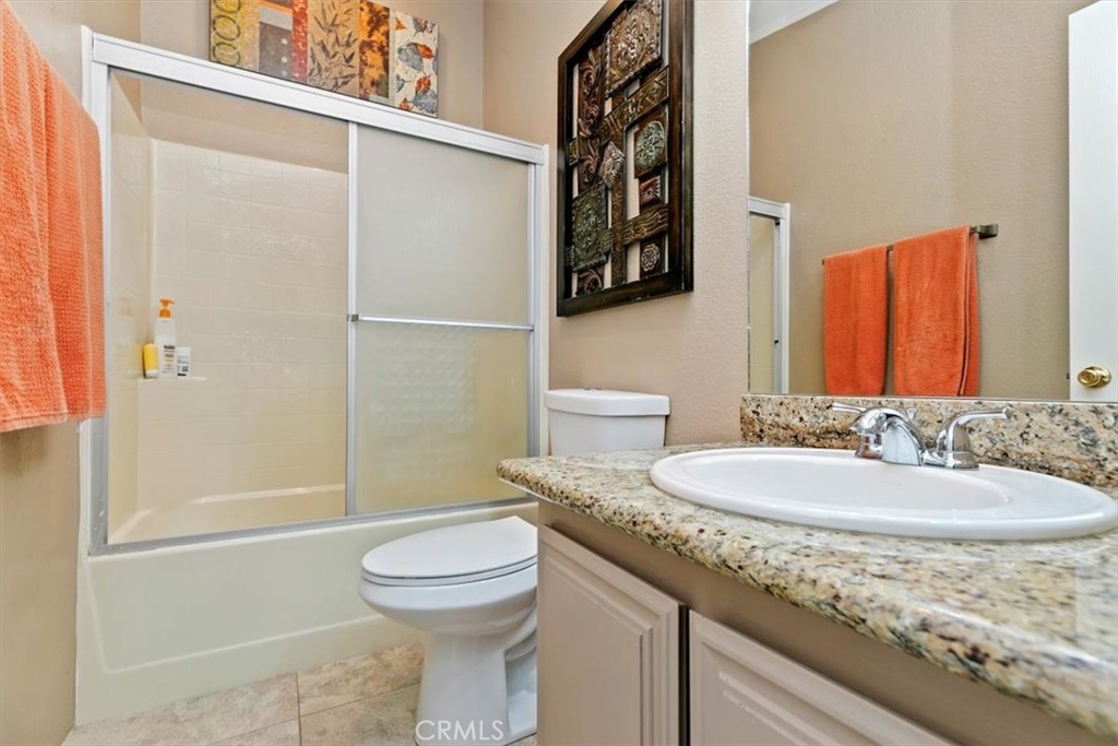 46618 Madison Street, Unit 85 Indio, CA 92201 - Photo 50 of 50 a bathroom with a granite countertop sink toilet and shower