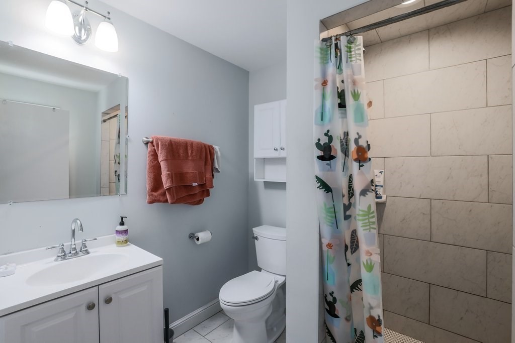 4 Ellis Drive Worcester, MA 01609 - Photo 26 of 32 a bathroom with a toilet sink and mirror