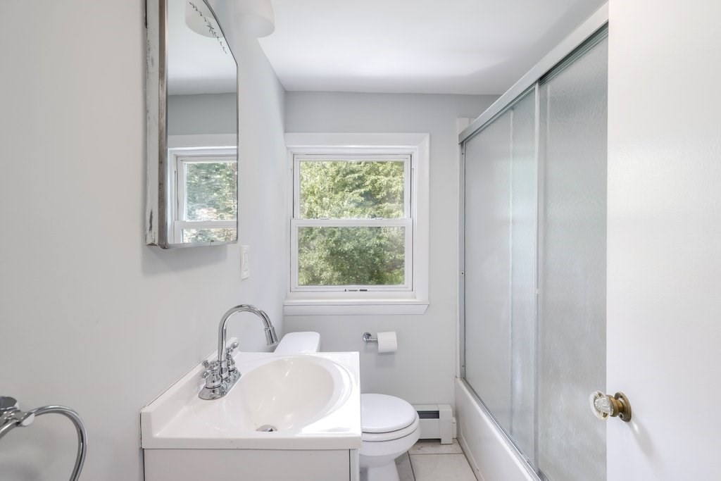 4 Ellis Drive Worcester, MA 01609 - Photo 30 of 32 a bathroom with a sink a toilet and a mirror