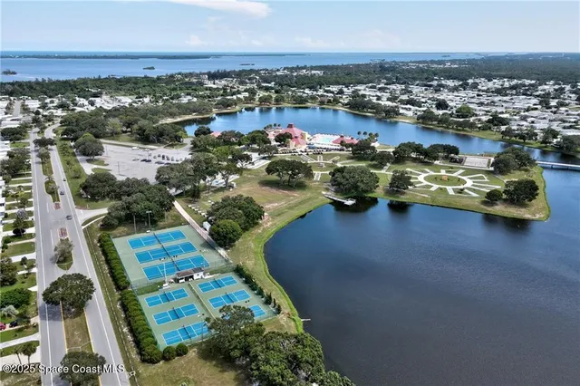an aerial view of a houses with outdoor space