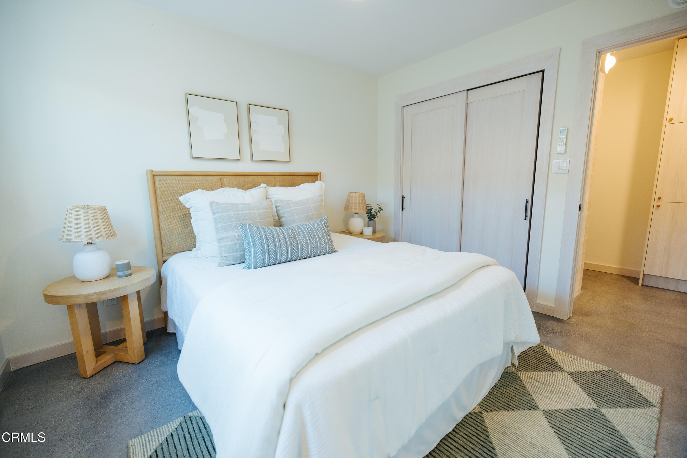 152 Arcade Drive Ventura, CA 93003 - Photo 11 of 25 a bedroom with a bed and a table in it