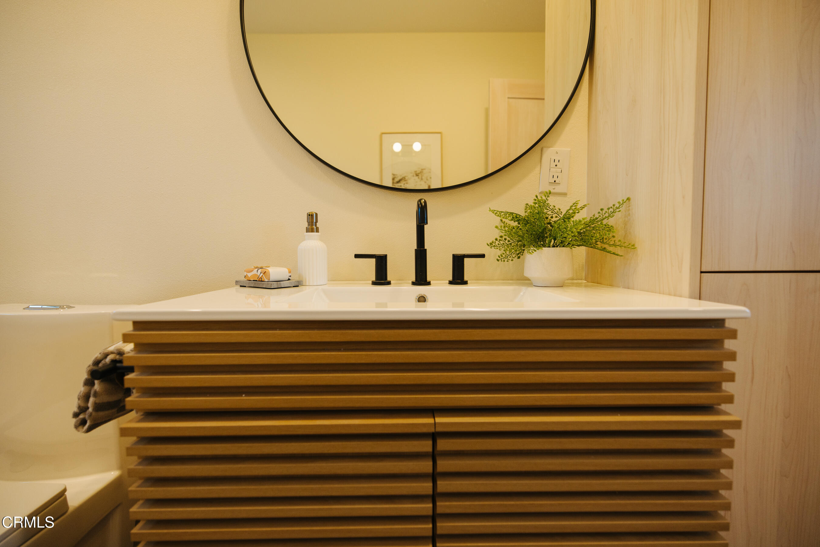 152 Arcade Drive Ventura, CA 93003 - Photo 19 of 25 a bathroom with a sink and a mirror