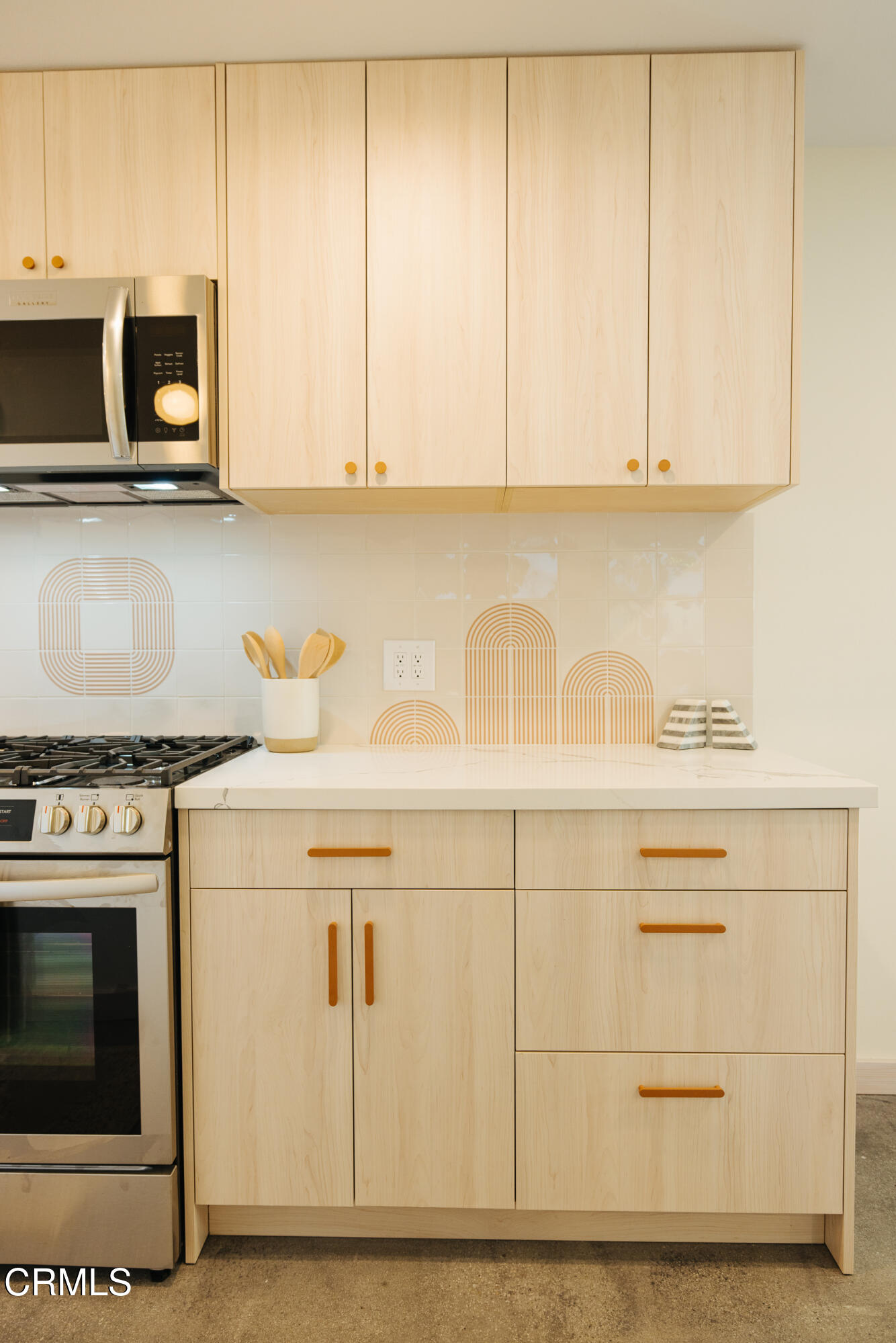 152 Arcade Drive Ventura, CA 93003 - Photo 9 of 25 a kitchen with stainless steel appliances granite countertop a sink a stove and microwave