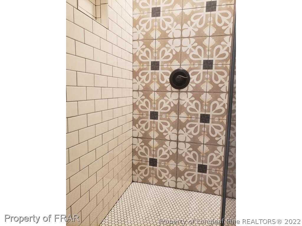2945 Hayfield Road Wade, NC 28395 - Photo 21 of 26 a bathroom with a shower