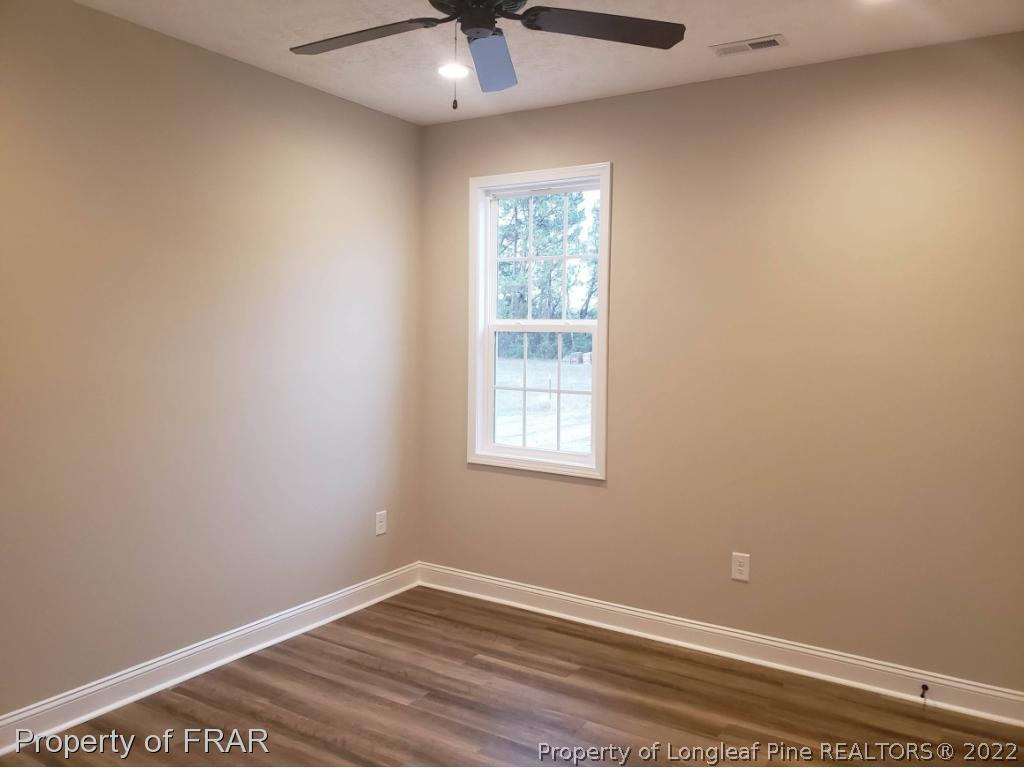 2945 Hayfield Road Wade, NC 28395 - Photo 7 of 26 an empty room with a window