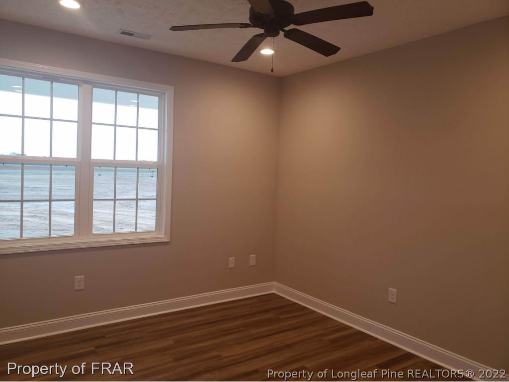 2945 Hayfield Road Wade, NC 28395 - Photo 8 of 26 an empty room with a window