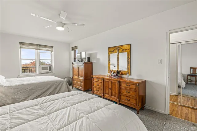 a bedroom with a bed and a lamp