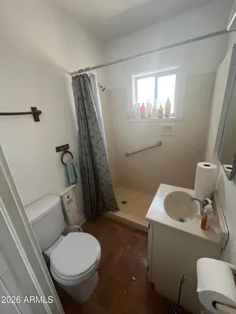 a bathroom with a toilet and a sink