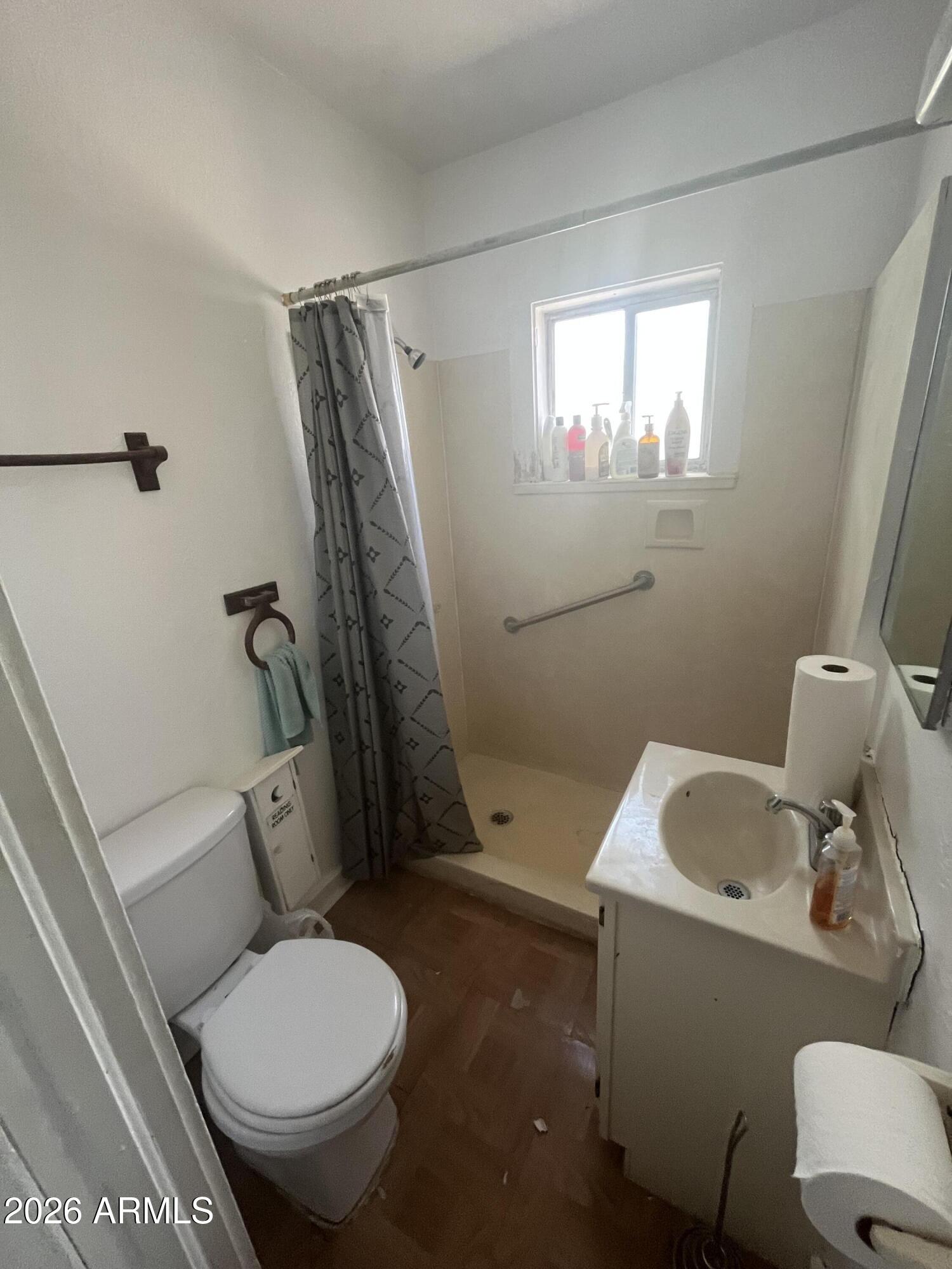 3610 North Elliott Road Ajo, AZ 85321 - Photo 15 of 20 a bathroom with a toilet and a sink