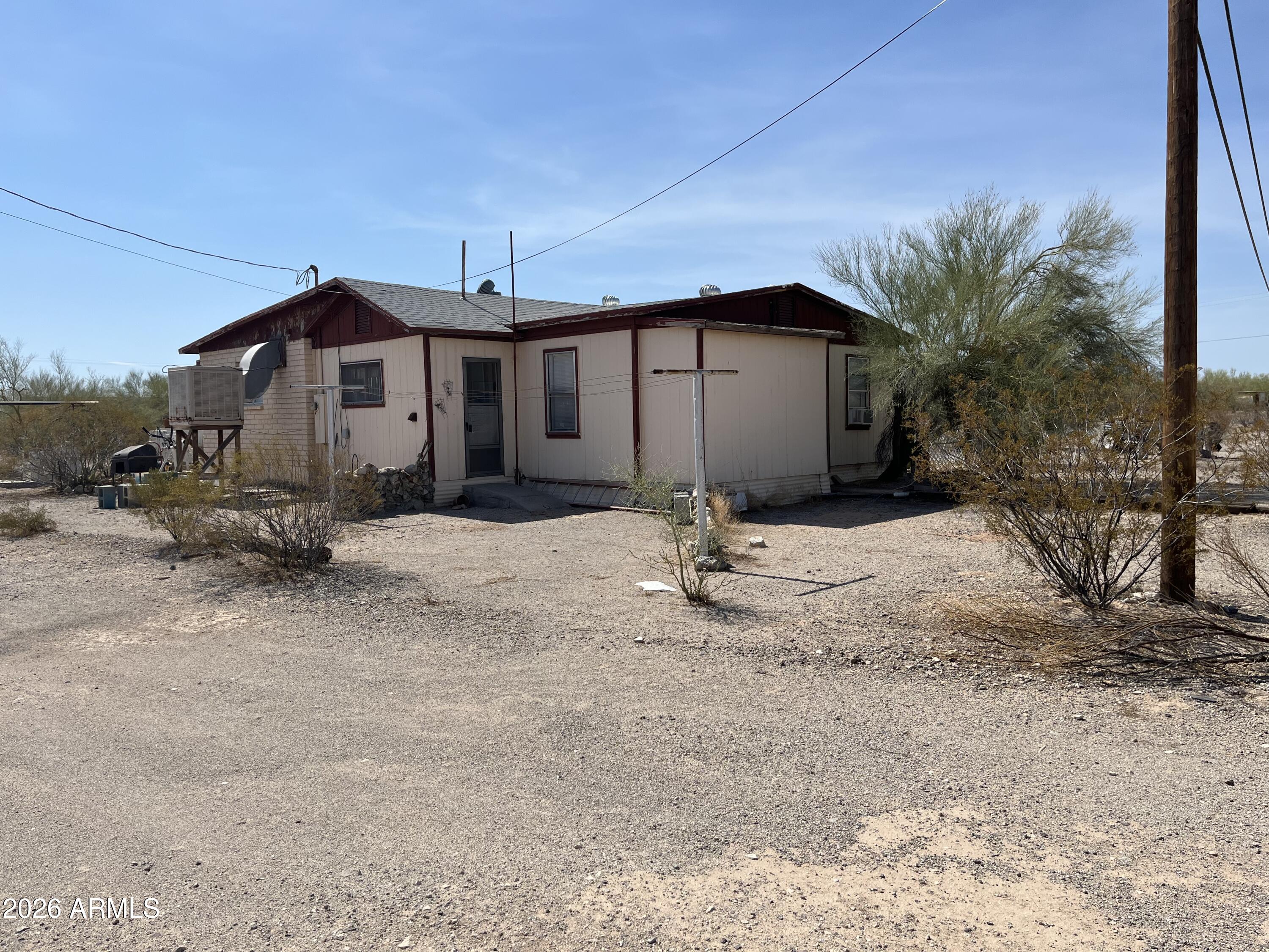 3610 North Elliott Road Ajo, AZ 85321 - Photo 5 of 20 a front view of a house with a yard