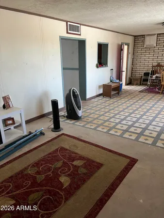a room with wooden floor and furniture