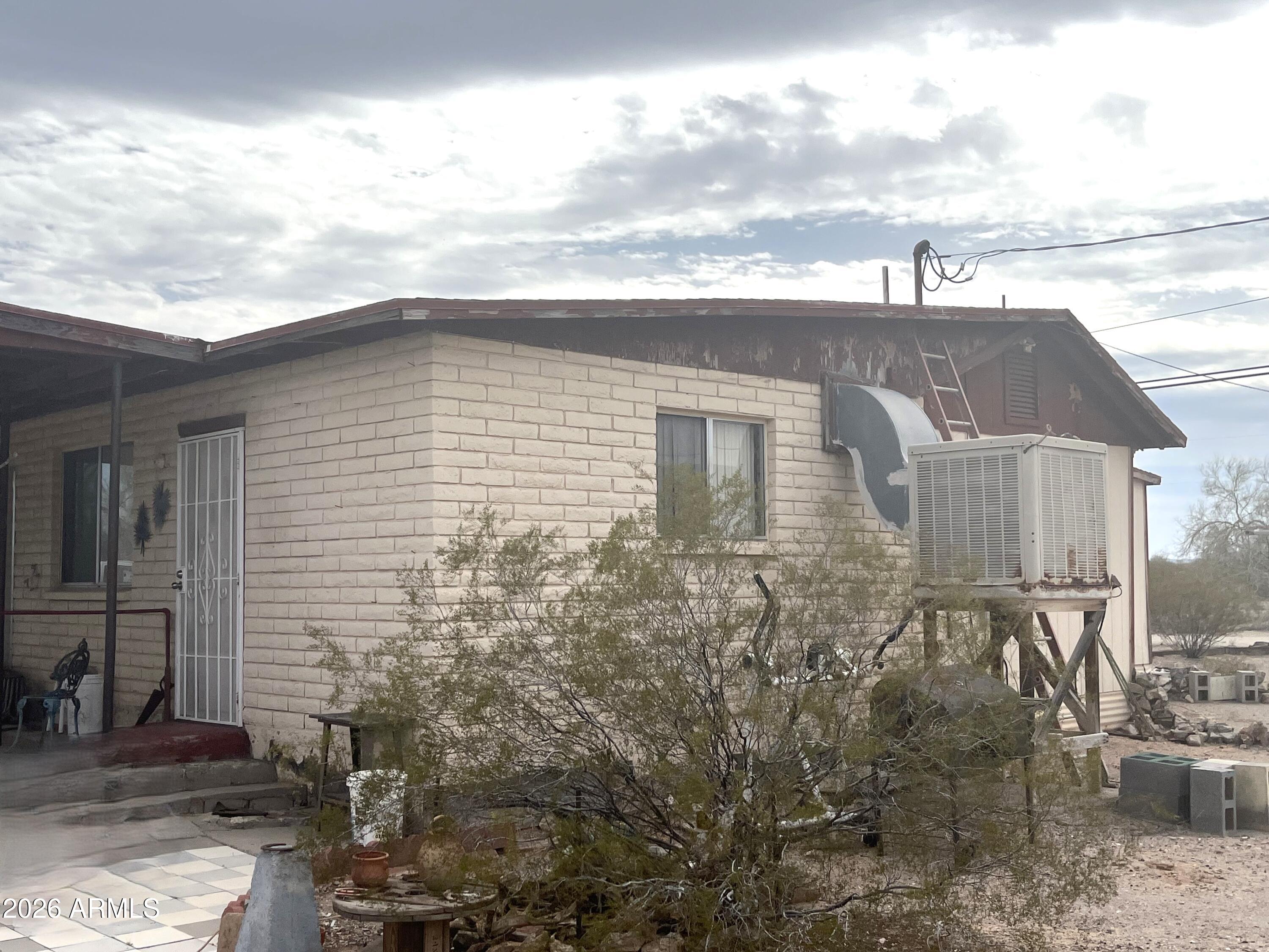 3610 North Elliott Road Ajo, AZ 85321 - Photo 8 of 20 a front view of a house with a yard