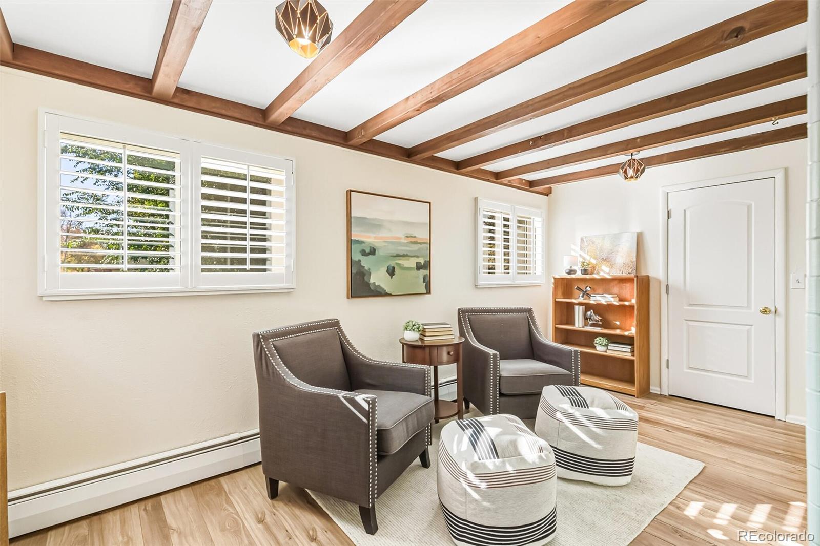 7221 West 48th Avenue Wheat Ridge, CO 80033 - Photo 11 of 42 a living room with furniture and a window