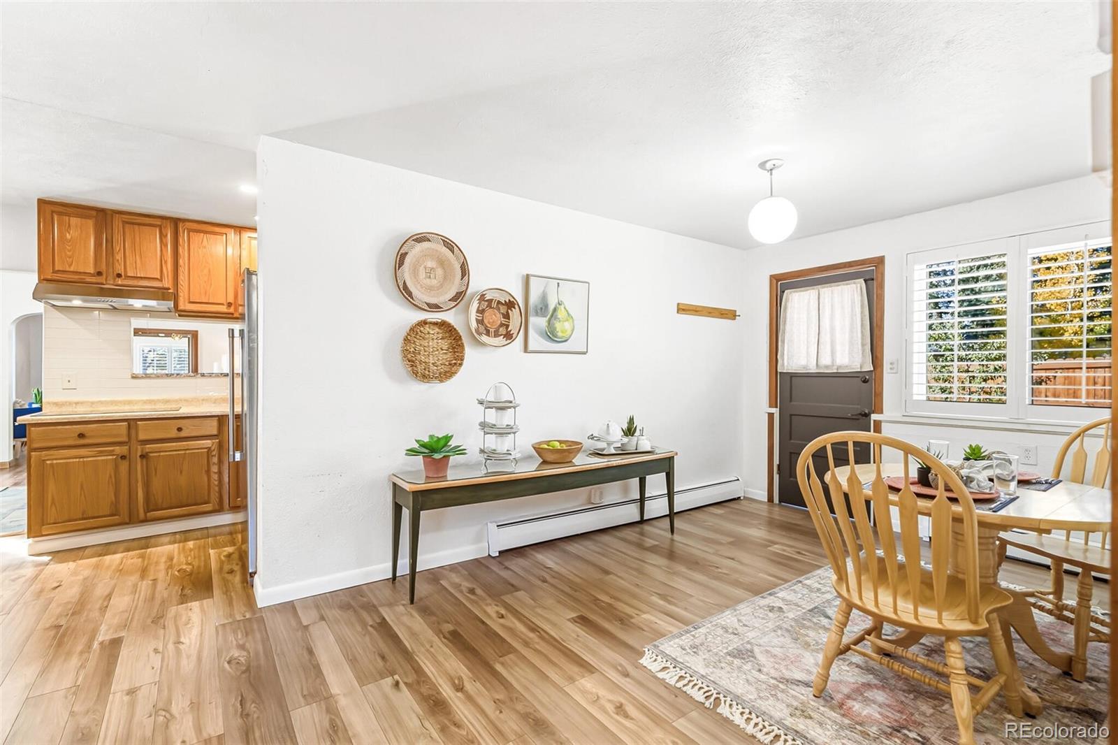 7221 West 48th Avenue Wheat Ridge, CO 80033 - Photo 18 of 42 a living room with furniture and a wooden floor