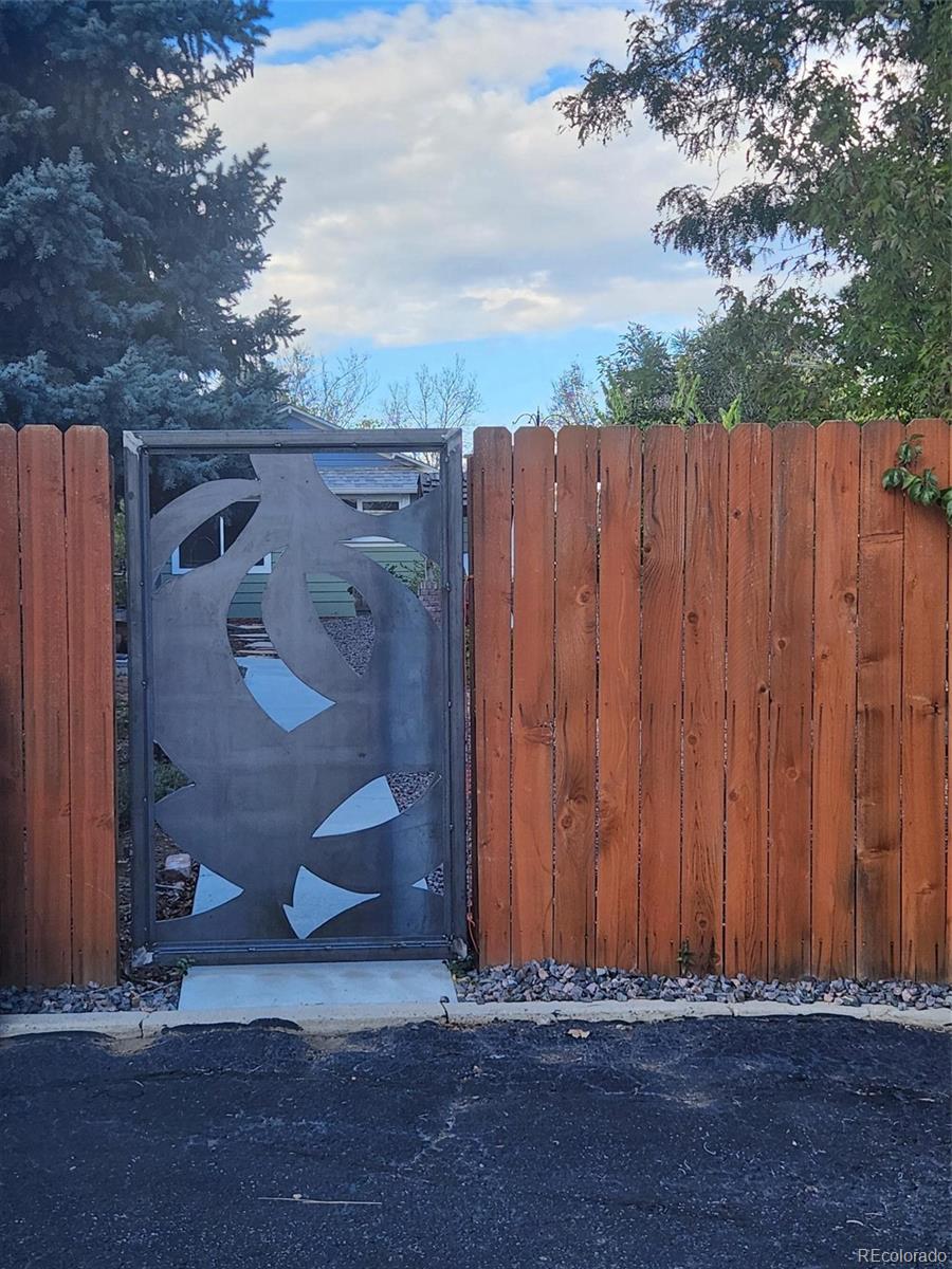 7221 West 48th Avenue Wheat Ridge, CO 80033 - Photo 31 of 42 a view of outdoor space with wooden fence