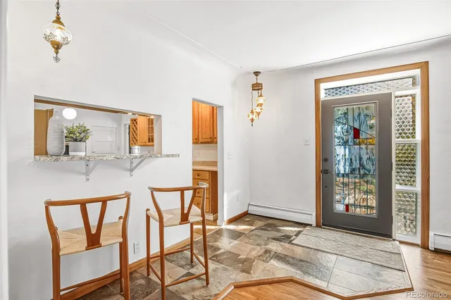 a dining room with furniture and window