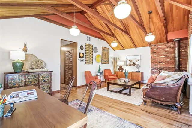 a living room with furniture and a table
