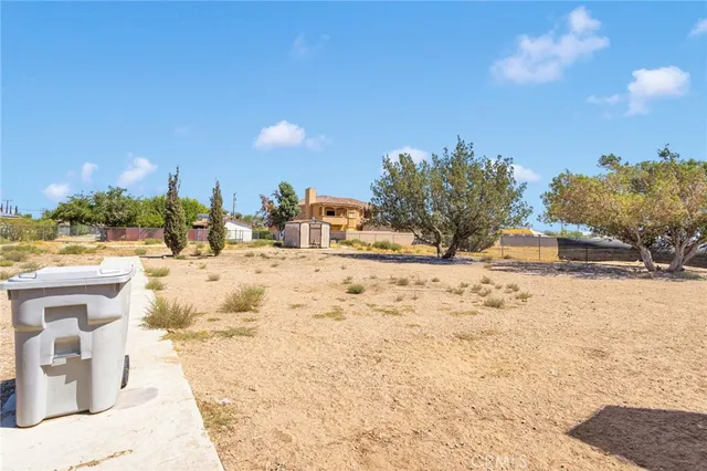 a view of a yard covered in snow